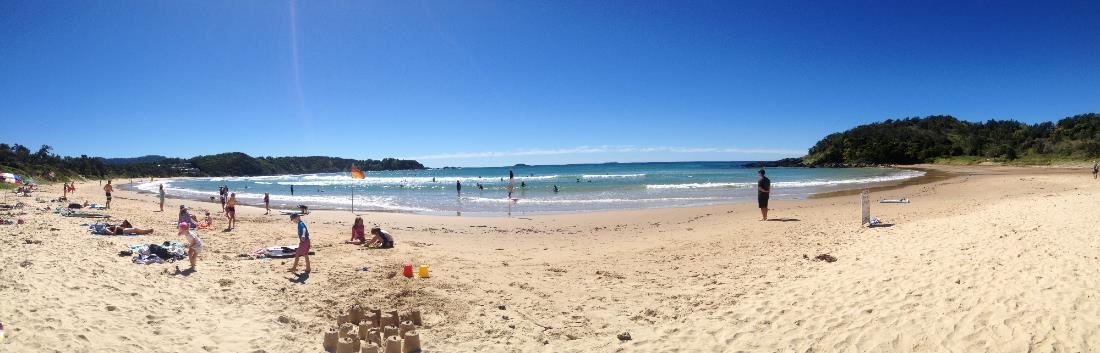Panorama showing people on Diggers Beach