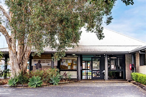 Outside view of Woolgoolga Hall with big tree on the left