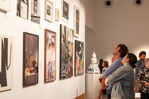 Guests looking at the winning artwork