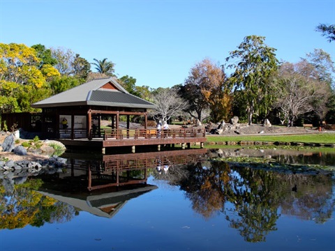View across pond to a Japanese pergola