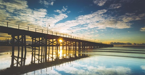 Photo of the Jetty Beach and timber jetty at sunrise